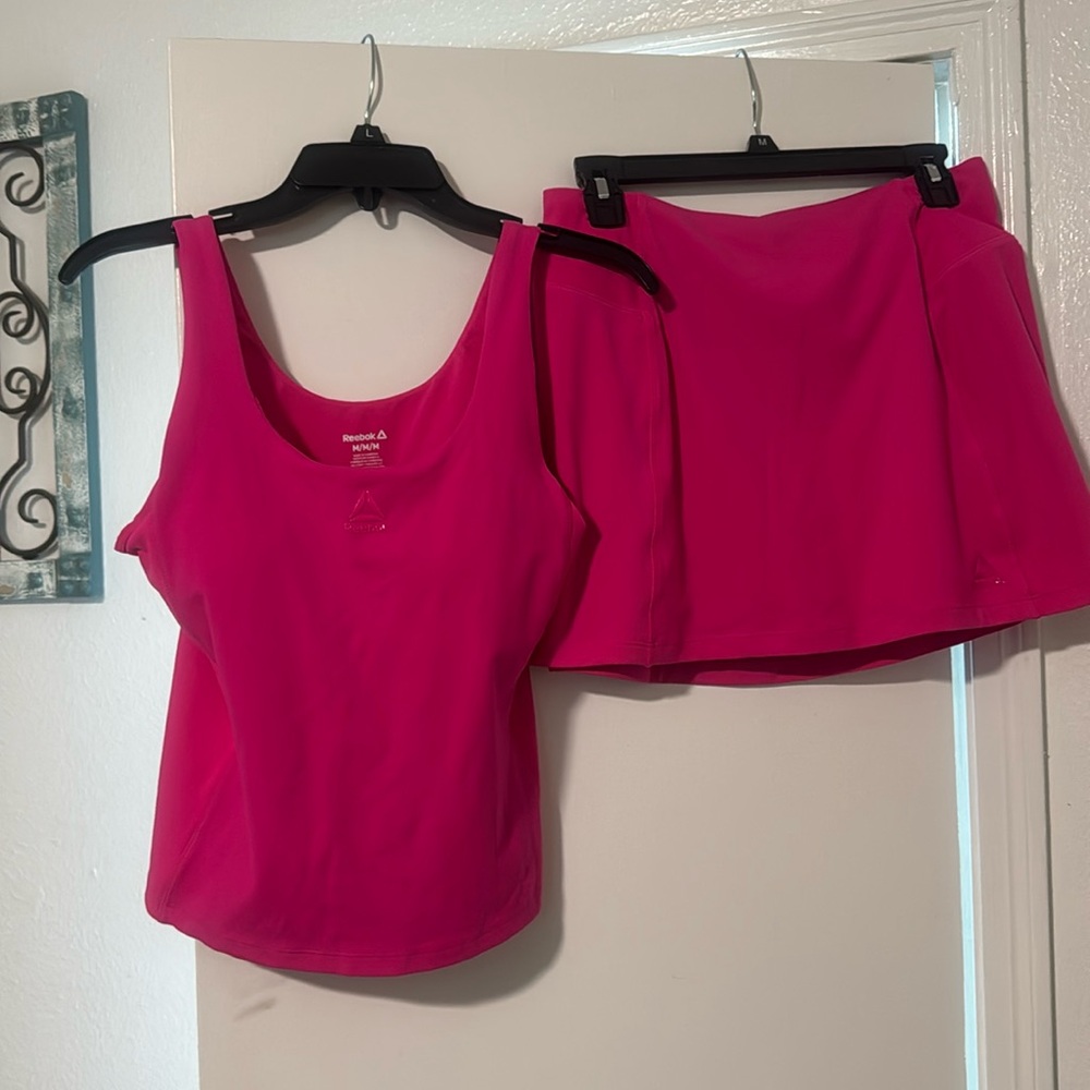 Pink Reebok  top and skort set brand new never worn.